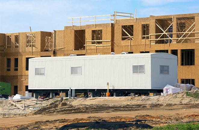 construction workers discussing plans in a rental office in Bedford, TX